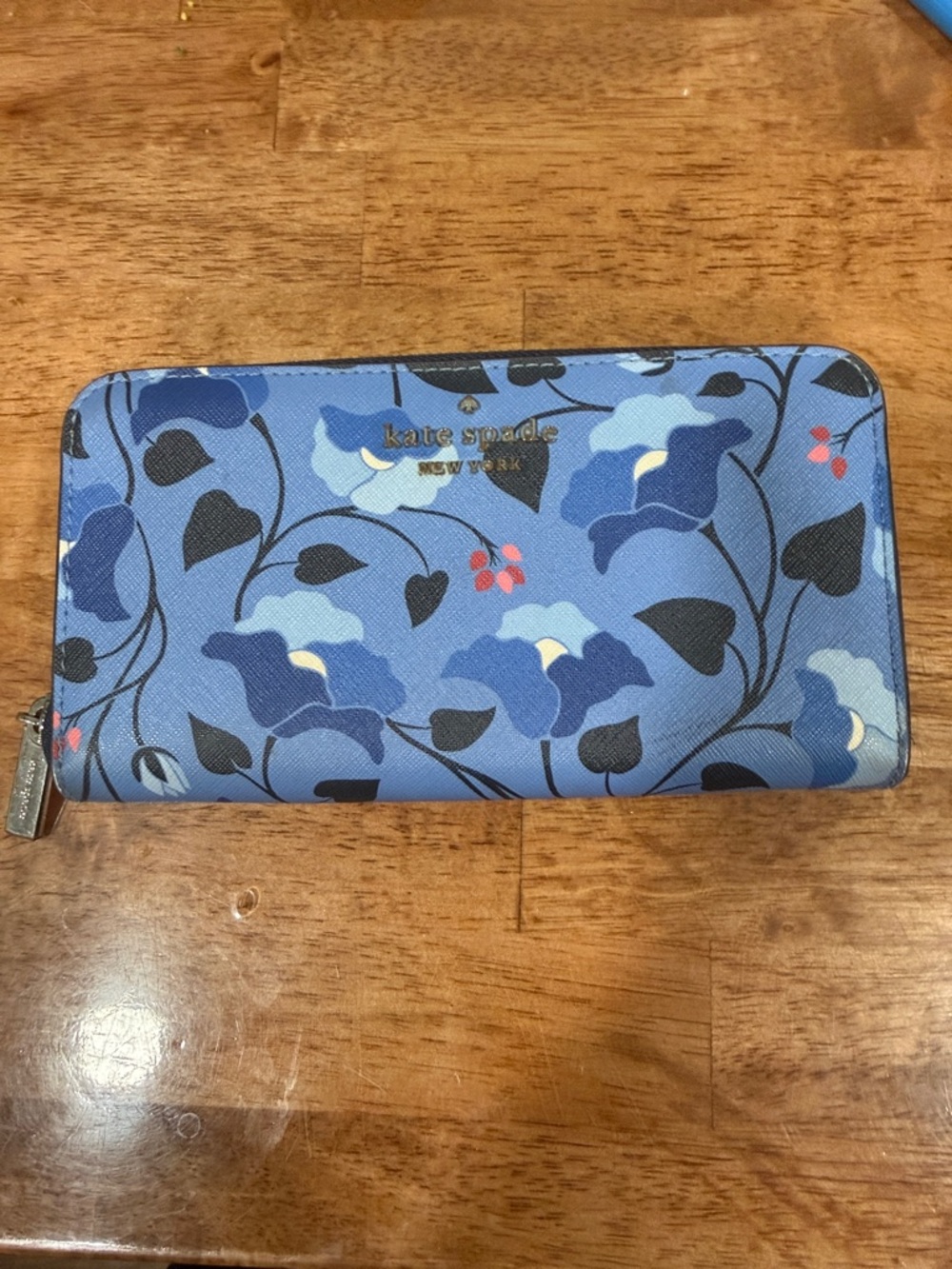 kate spade blue floral zip-around wallet with gold logo